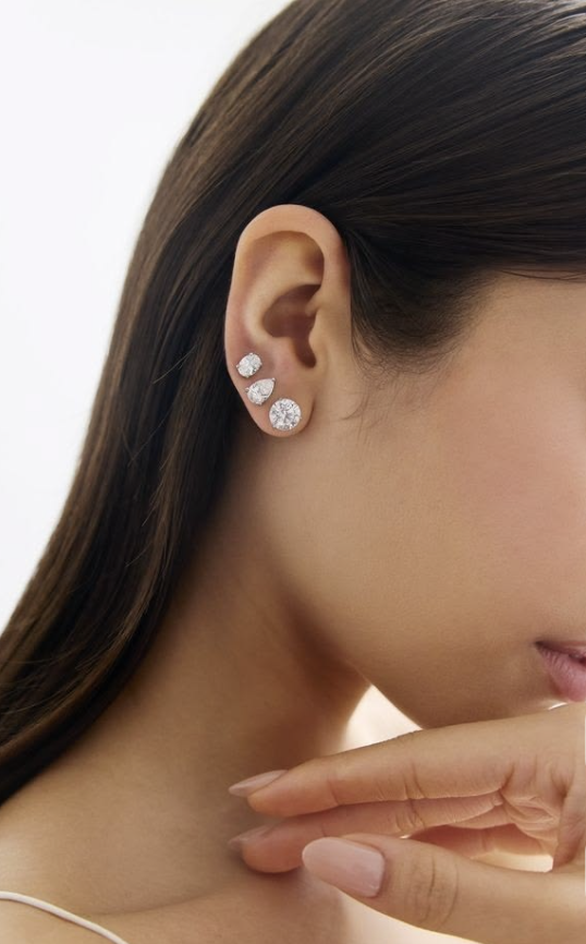 Diamond earrings and bracelet styled on the ear and hand